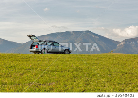 hatchback car on the top of the hill hatchback car on the top of the hill 39540403