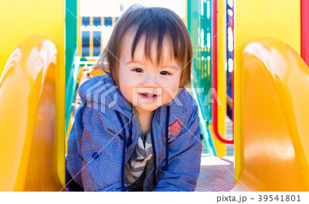 Toddler boy playing on the playground 39541801