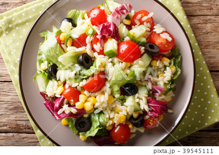 Tasty salad of fresh vegetables, rice and lettuce Tasty salad of fresh vegetables, rice and lettuce 39545111