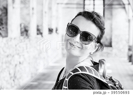Joyful woman in medieval corridor, Telc, colorless Joyful woman in medieval corridor, Telc, colorless 39550693