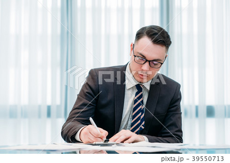 handsome successful business man working office 39550713