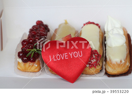 Traditional French dessert eclair with plush heart Traditional French dessert eclair with plush heart 39553220