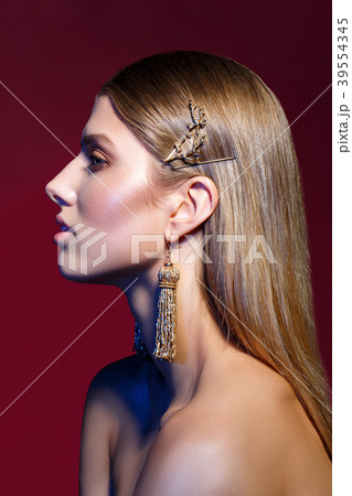 beautiful girl with long earrings beautiful girl with long earrings 39554345