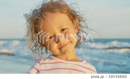 Facial portrait of beautiful little girl standing Facial portrait of beautiful little girl standing 39556660