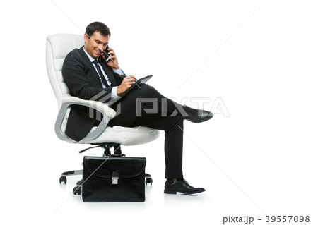 handsome businessman in suit sitting on armchair handsome businessman in suit sitting on armchair 39557098
