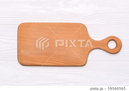 Kitchen cutting board on a white wooden background, top view 39560565