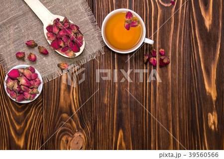 Flat lay layout with herbal tea with rosebuds. White cup with hot tea Flat lay layout with herbal tea with rosebuds. White cup with hot tea 39560566