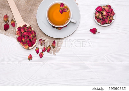 Flat lay layout with herbal tea with rosebuds. White cup with hot tea 39560885