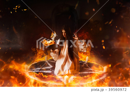 Woman sitting in burning pentagram circle, magic Woman sitting in burning pentagram circle, magic 39560972