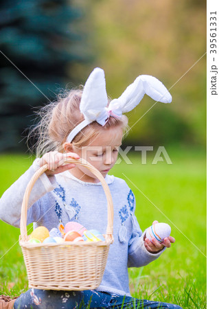Portrait of little girl with a basket full of 39561331