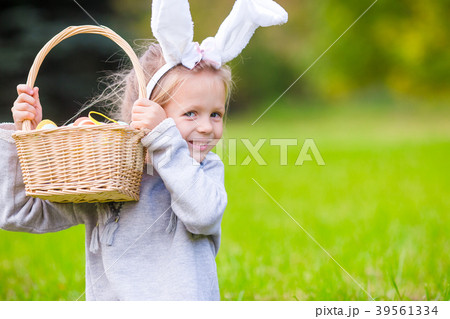 Portrait of kid on Easter with eggs outdoor 39561334
