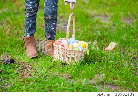 Closeup basket with colorful Easter eggs on the 39561338