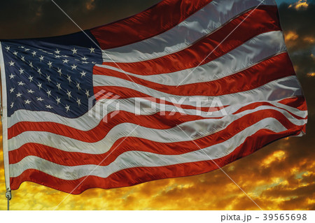 American flag flying, over beautiful Sunset  39565698
