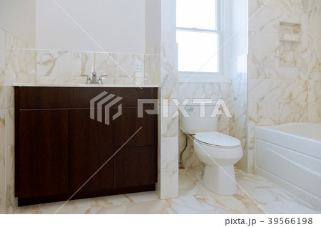 Bathroom with oval marble sink and shower curtain. Bathroom with oval marble sink and shower curtain. 39566198