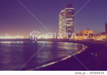 Barceloneta beach with Mapfre tower and Arts Hotel in night Barceloneta beach with Mapfre tower and Arts Hotel in night 39566976