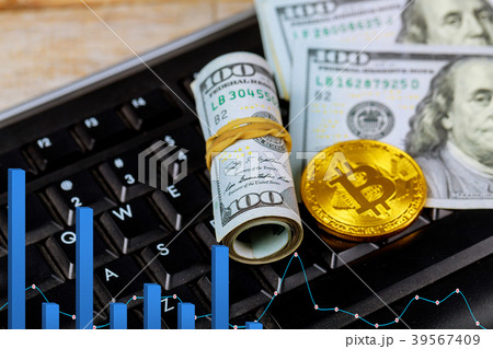 Golden dogecoin cryptocurrency coin lying keyboard 39567409