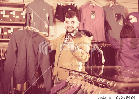 Couple deciding on track jacket 39569434