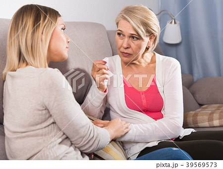 daughter comforts a sad mother daughter comforts a sad mother 39569573