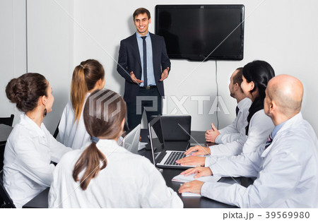 Manager making speech during business meeting Manager making speech during business meeting 39569980