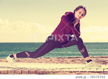 woman working out in beach 39570702