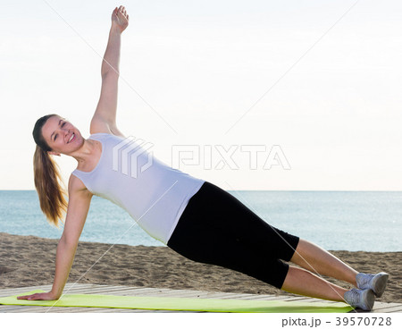 Woman doing yoga sitting Woman doing yoga sitting 39570728