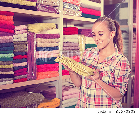Woman choosing towels 39570808