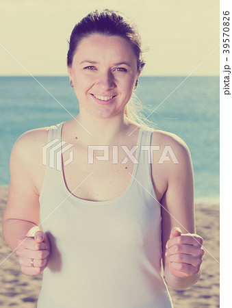 Woman running on beach Woman running on beach 39570826