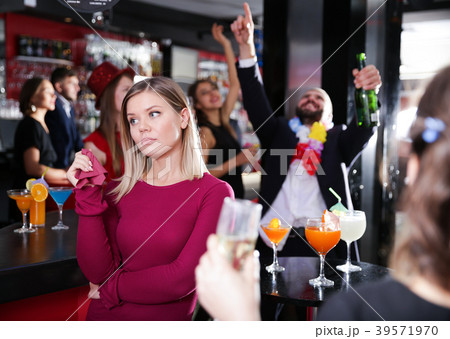 Offended woman with drunk man on party at nightclub 39571970
