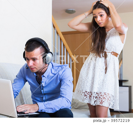 Woman suspecting spouse spending money 39572219