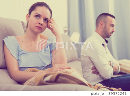 Sad female is depressing and husband is supporting her Sad female is depressing and husband is supporting her 39572241