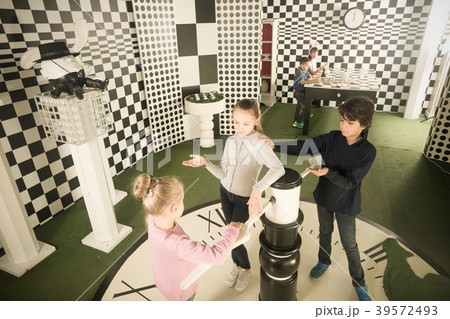 children with interest play in chess quest room 39572493