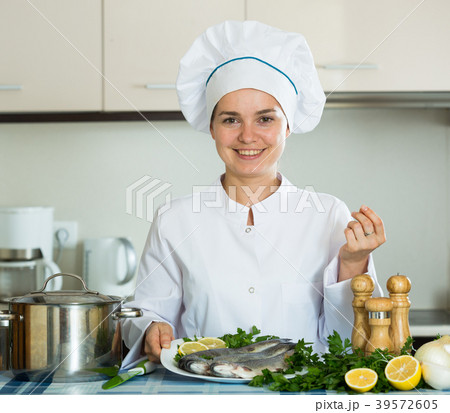 Professional chef cooking fresh trout at kitchen 39572605