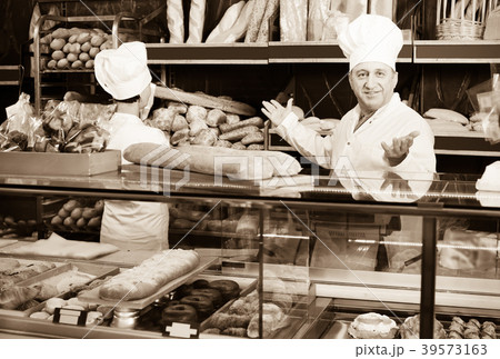professional bakers with fresh bread in bakery professional bakers with fresh bread in bakery 39573163