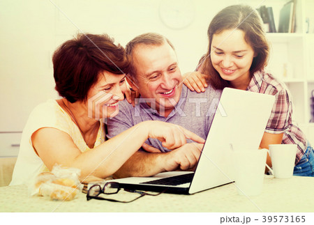 Senior couple with adult daughter Senior couple with adult daughter 39573165