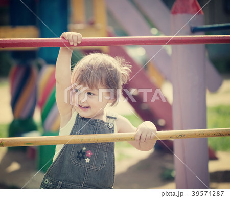 Portrait of two-year child at playground Portrait of two-year child at playground 39574287