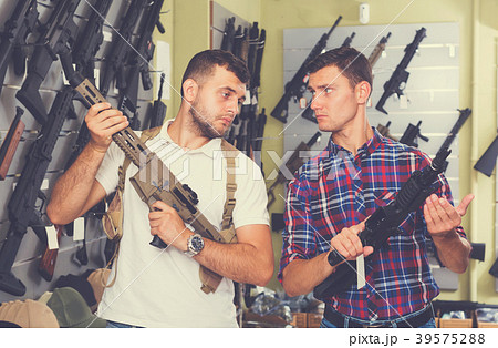 Men choosing air weapon Men choosing air weapon 39575288