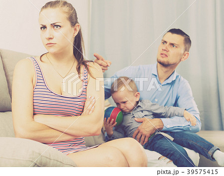 Sad male and female with child thinking about quarrel Sad male and female with child thinking about quarrel 39575415
