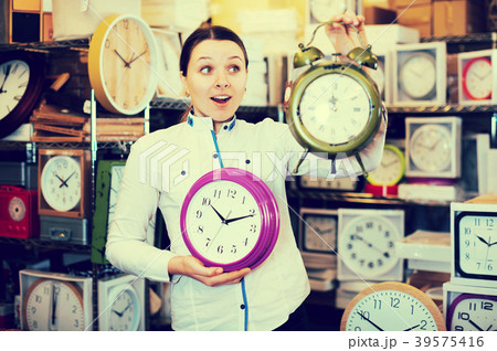 woman is holding clock woman is holding clock 39575416