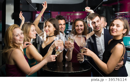 Smiling colleagues dancing with cocktails 39576114
