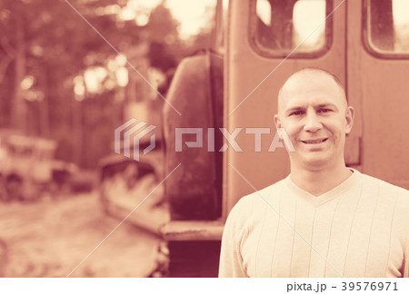 tractor operator at workplace tractor operator at workplace 39576971