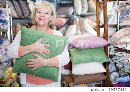 mature woman consumer with pillow mature woman consumer with pillow 39577433