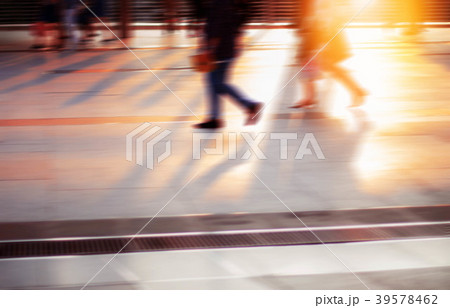 People walking at sunset. 39578462