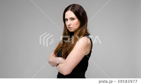 Attractive young serious angry brunette caucasian 39583977