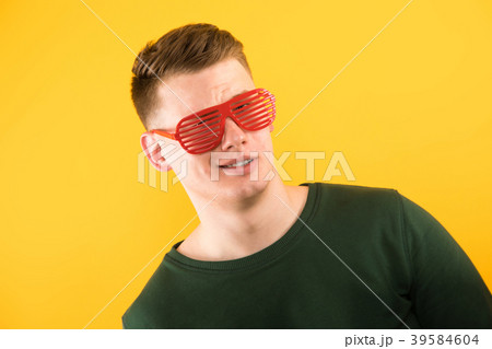 Portrait of young handsome smiling guy with 39584604