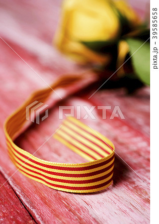 catalan flag and yellow rose. catalan flag and yellow rose. 39585658