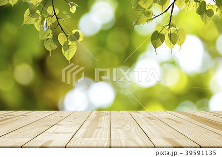 Empty wooden table and Green leaves (Bonhi) Empty wooden table and Green leaves (Bonhi) 39591135