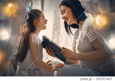 Family reading bedtime. Family reading bedtime. 39595467