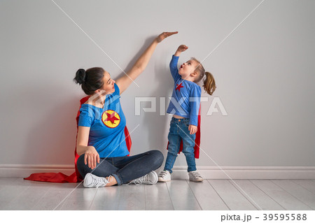 Mother is measuring growth of child Mother is measuring growth of child 39595588