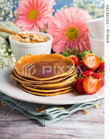 Stack of oatmeal pancakes with strawberries Stack of oatmeal pancakes with strawberries 39598380