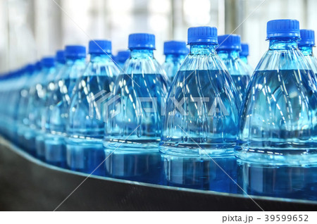 Closeup on mineral water bottles in raw and lines Closeup on mineral water bottles in raw and lines 39599652
